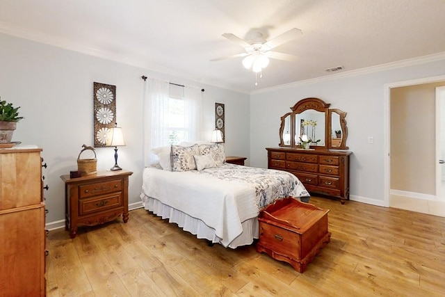 bedroom featuring crown molding, ceiling fan, and light hardwood / wood-style flooring