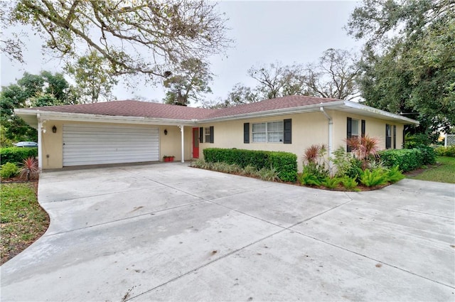 ranch-style house featuring a garage