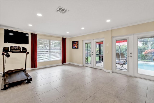 exercise room featuring french doors, a healthy amount of sunlight, and crown molding