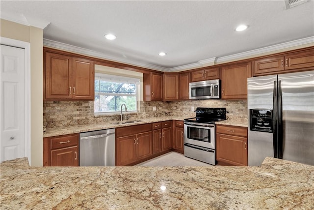 kitchen featuring ornamental molding, appliances with stainless steel finishes, sink, and backsplash