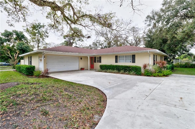 ranch-style house featuring a garage