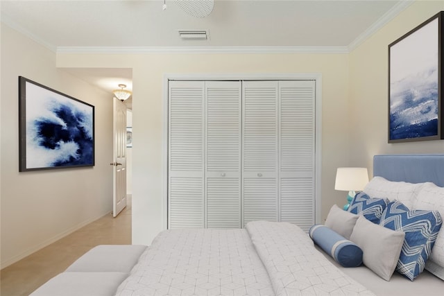 bedroom with crown molding, light colored carpet, and a closet