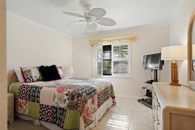 bedroom featuring ornamental molding, light tile patterned floors, and ceiling fan