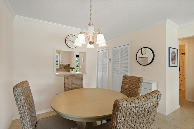 dining space featuring an inviting chandelier and ornamental molding