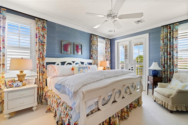 carpeted bedroom with ceiling fan, access to exterior, and ornamental molding