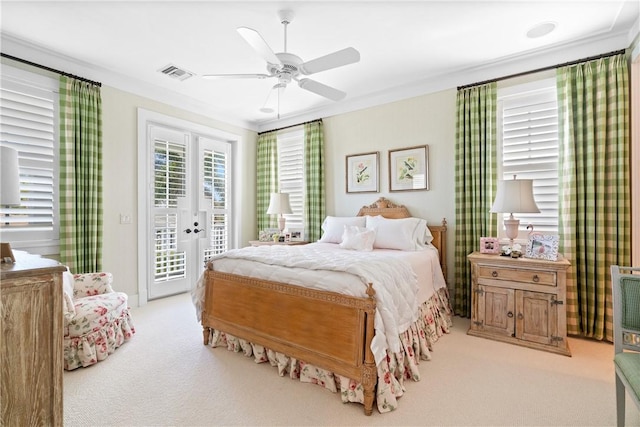 carpeted bedroom with access to exterior, ceiling fan, crown molding, and french doors