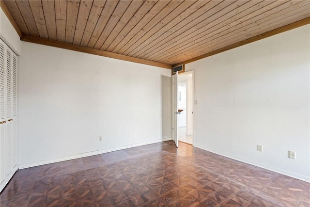 unfurnished room with ornamental molding, dark parquet floors, and wooden ceiling