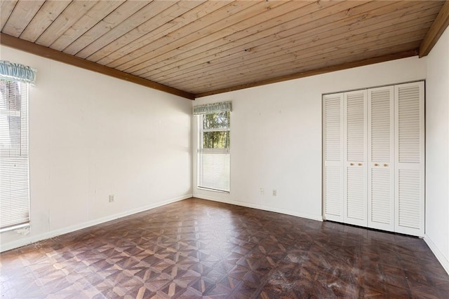 unfurnished bedroom featuring dark parquet flooring, ornamental molding, and wooden ceiling