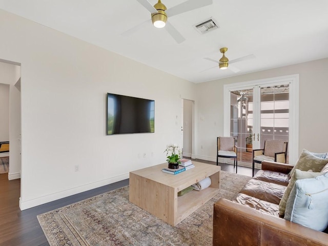 living area featuring french doors, visible vents, ceiling fan, wood finished floors, and baseboards