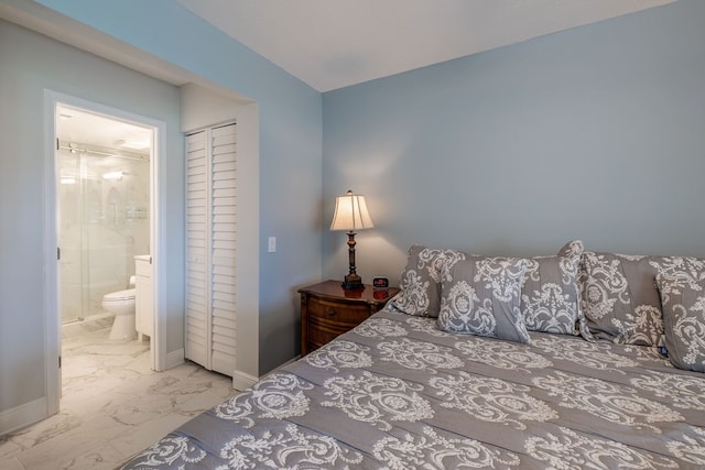 bedroom with a closet and ensuite bath