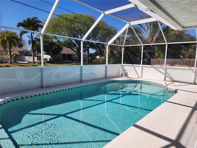 view of pool featuring a fenced in pool, a patio, glass enclosure, and fence