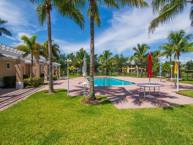 view of swimming pool with a pergola, a patio area, and a lawn