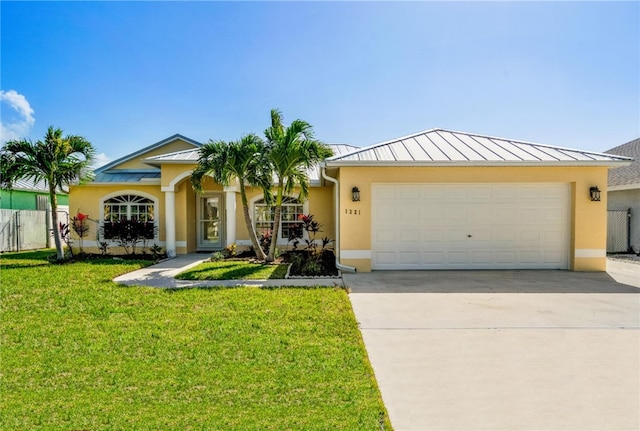 ranch-style house featuring a garage and a front yard