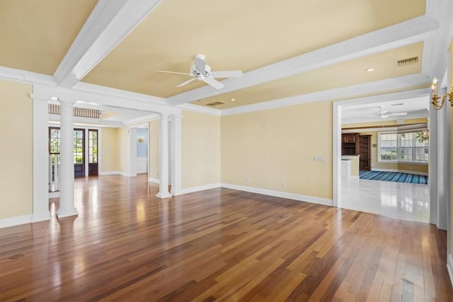 505 Live Oak Rd, Vero Beach, FL 32963 - unfurnished living room featuring decorative columns, ceiling fan, hardwood / wood-style floors, crown molding, and beam ceiling