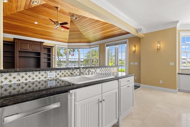 505 Live Oak Rd, Vero Beach, FL 32963 - kitchen with wood ceiling, stainless steel dishwasher, a ceiling fan, dark countertops, and plenty of natural light