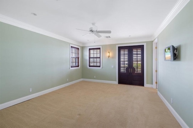 505 Live Oak Rd, Vero Beach, FL 32963 - entrance foyer with crown molding, light carpet, ceiling fan, and french doors