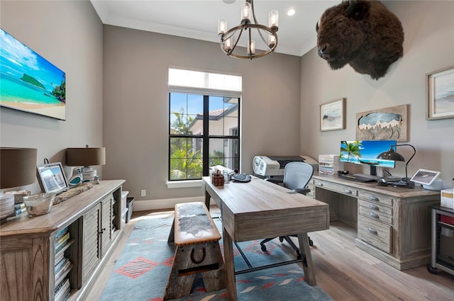 office area with ornamental molding, light hardwood / wood-style floors, and a chandelier