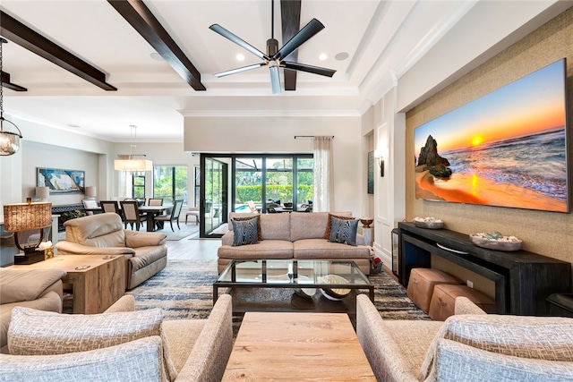 living room featuring beamed ceiling, a wealth of natural light, wood-type flooring, and ceiling fan with notable chandelier