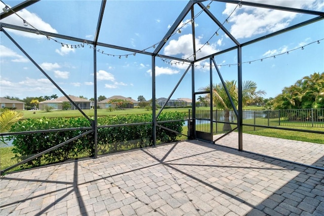 765 Fortunella Cir SW, Vero Beach, FL 32968 - view of patio / terrace with a water view, a lanai, and fence