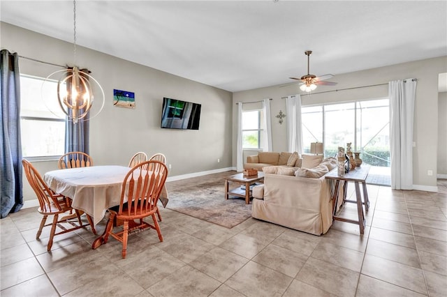 765 Fortunella Cir SW, Vero Beach, FL 32968 - dining room with a chandelier, baseboards, ceiling fan, and light tile patterned floors