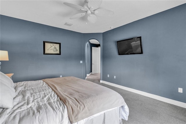 765 Fortunella Cir SW, Vero Beach, FL 32968 - bedroom with arched walkways, carpet floors, baseboards, and ceiling fan