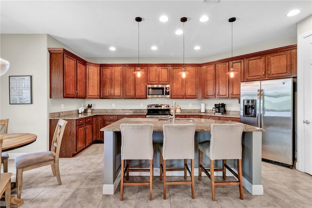 765 Fortunella Cir SW, Vero Beach, FL 32968 - kitchen with stainless steel appliances, a sink, brown cabinetry, and recessed lighting