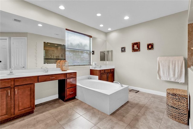 765 Fortunella Cir SW, Vero Beach, FL 32968 - full bathroom featuring recessed lighting, a bath, a tile shower, two vanities, and tile patterned floors