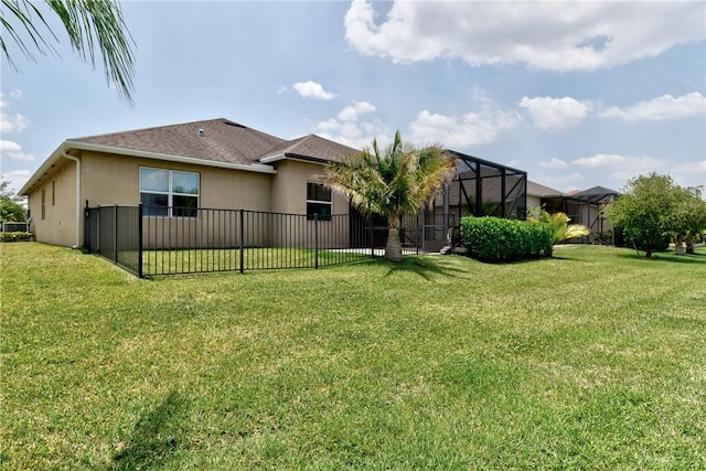 765 Fortunella Cir SW, Vero Beach, FL 32968 - back of house featuring stucco siding and a shingled roof