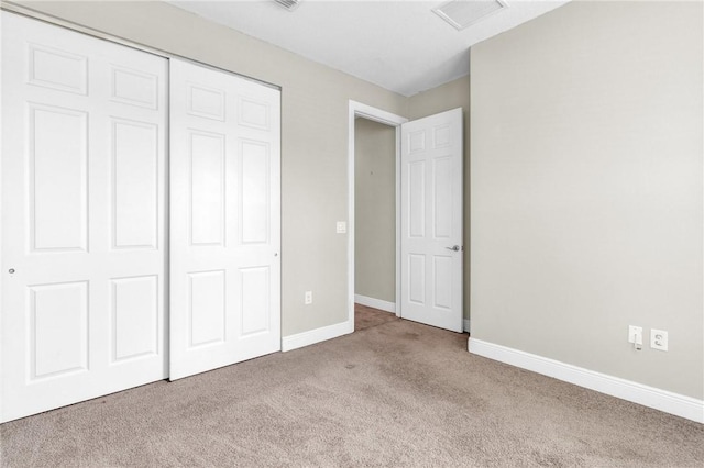 765 Fortunella Cir SW, Vero Beach, FL 32968 - unfurnished bedroom with carpet, a closet, and baseboards
