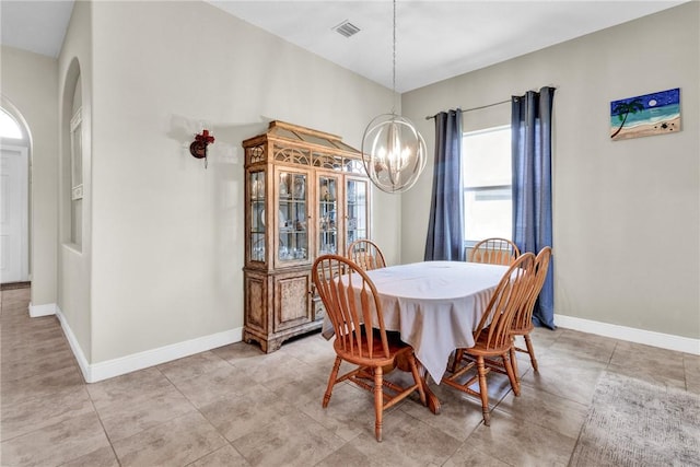 765 Fortunella Cir SW, Vero Beach, FL 32968 - dining space with a chandelier, baseboards, and arched walkways