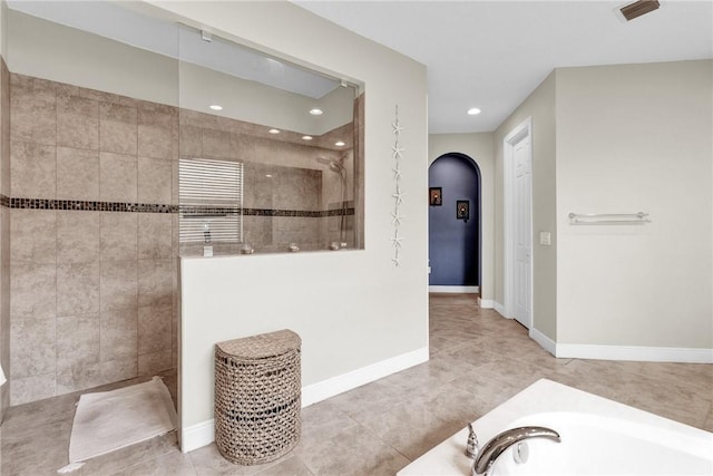 765 Fortunella Cir SW, Vero Beach, FL 32968 - bathroom featuring walk in shower, recessed lighting, a garden tub, tile patterned floors, and baseboards