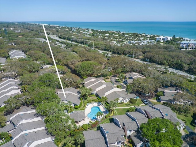 drone / aerial view with a residential view and a water view