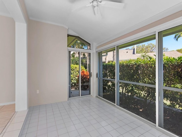 unfurnished sunroom with a ceiling fan and lofted ceiling