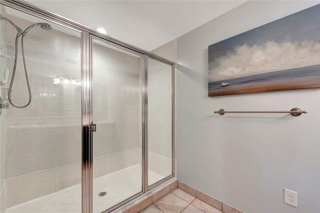 bathroom with walk in shower and tile patterned floors