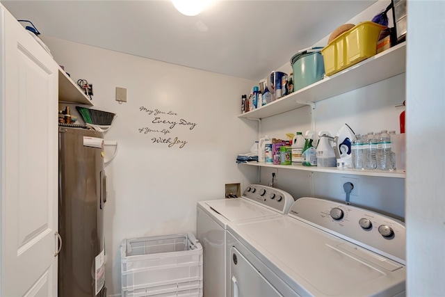 laundry area featuring washing machine and dryer and water heater