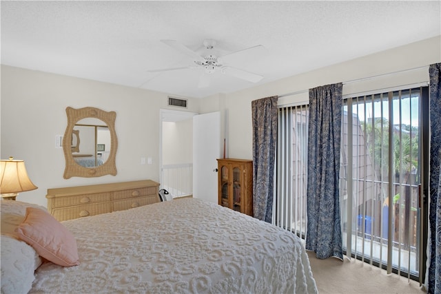 bedroom featuring carpet, a textured ceiling, and ceiling fan