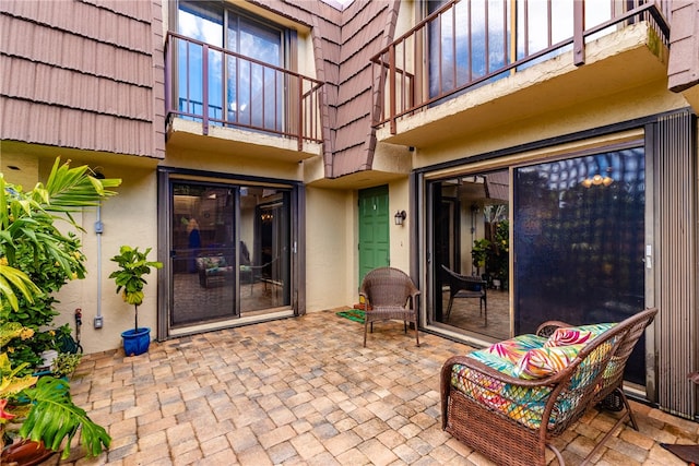 view of patio featuring a balcony