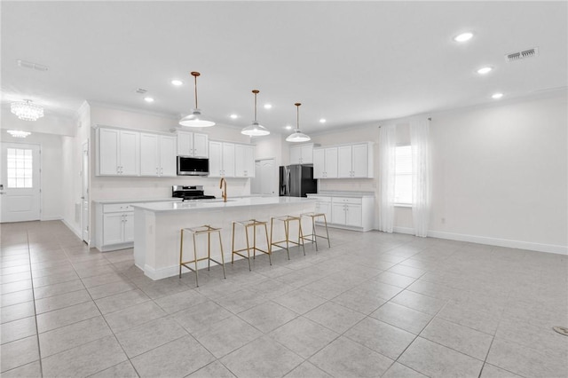 3577 Loblolly Sq, Vero Beach, FL 32966 - kitchen featuring appliances with stainless steel finishes, light tile patterned floors, recessed lighting, baseboards, and ornamental molding
