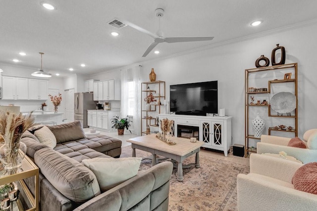 3577 Loblolly Sq, Vero Beach, FL 32966 - living room featuring crown molding, recessed lighting, and a ceiling fan