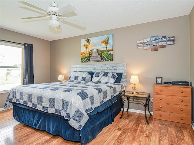 bedroom featuring hardwood / wood-style flooring and ceiling fan