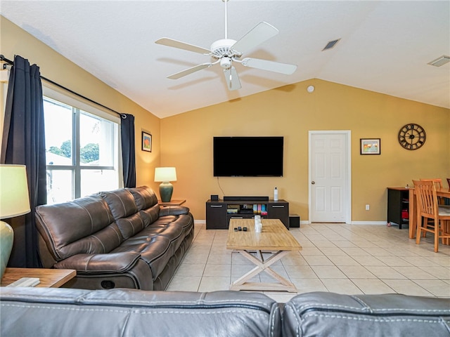 living room with lofted ceiling, light tile patterned floors, and ceiling fan