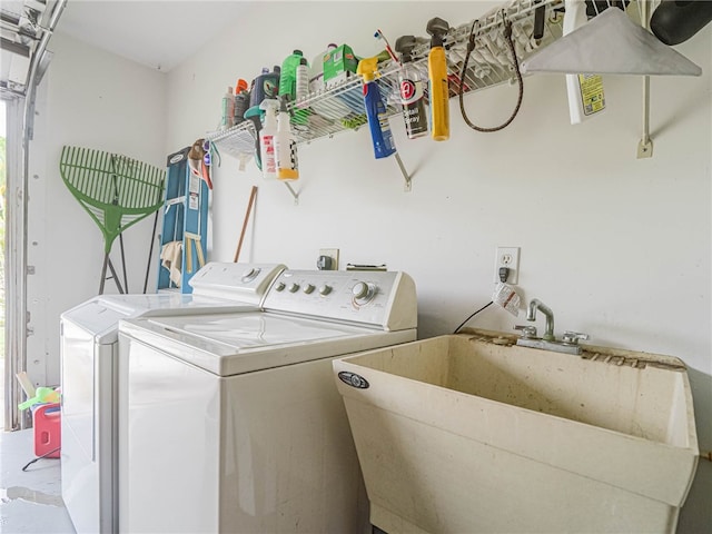 laundry room featuring sink and washer and dryer