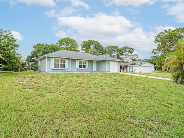 ranch-style home with a garage and a front yard