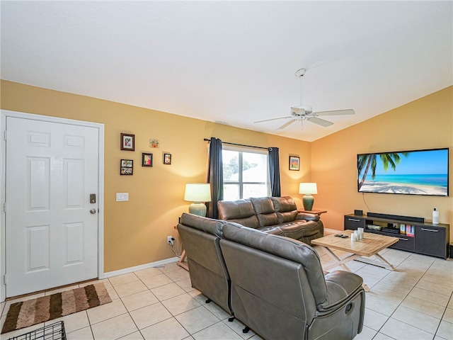 tiled living room with vaulted ceiling and ceiling fan