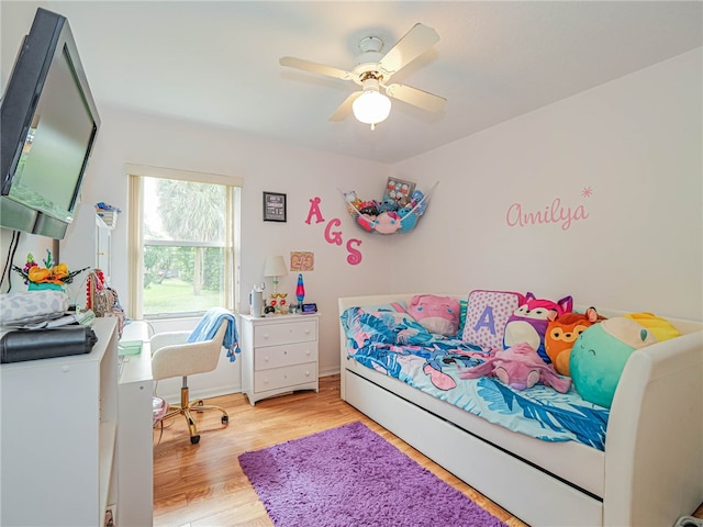 bedroom featuring light hardwood / wood-style floors and ceiling fan