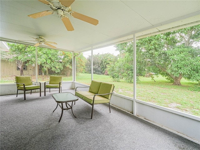 sunroom / solarium featuring ceiling fan