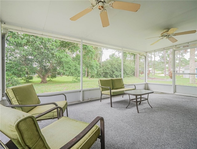 sunroom / solarium featuring ceiling fan