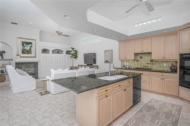 kitchen featuring a sink, light brown cabinets, ceiling fan, and black appliances