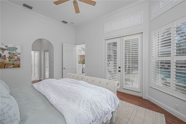 bedroom featuring visible vents, ornamental molding, wood finished floors, access to outside, and arched walkways