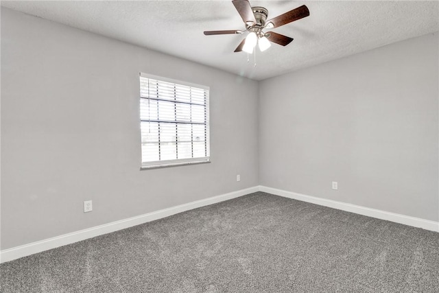 carpeted spare room with a textured ceiling and ceiling fan